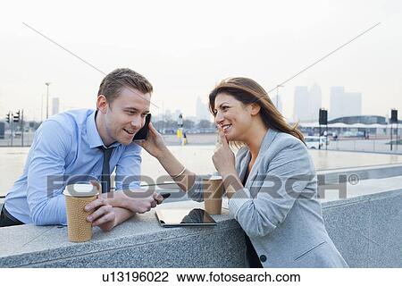 Business people talking on cell phone View Large Photo Image Stock Image - Business people talking on cell phone. Fotosearch