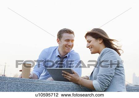 Business people using tablet computer View Large Photo Image Stock Image - Business people using tablet computer. Fotosearch
