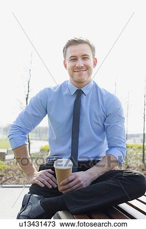 Businessman drinking coffee outdoors View Large Photo Image Stock Image - Businessman drinking coffee outdoors. Fotosearch
