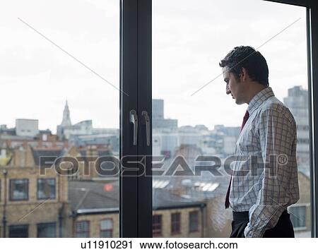 Businessman looking at urban landscape View Large Photo Image Stock Image - Businessman looking at urban landscape. Fotosearch