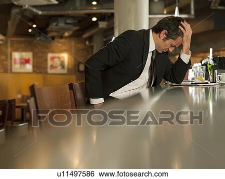 Businessman reading newspaper in cafe View Large Photo Image Stock Photograph - Businessman reading newspaper in cafe. Fotosearch