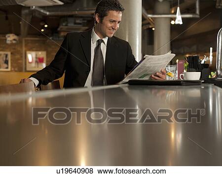 Stock Photo - Businessman working in cafe. Fotosearch