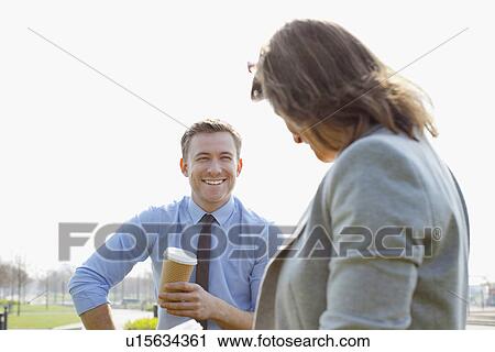 Businesspeople talking outdoors View Large Photo Image Stock Image - Businesspeople talking outdoors. Fotosearch