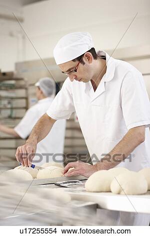 Picture - Chef baking in kitchen. Fotosearch