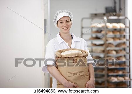 Chef carrying sack of flour in kitchen View Large Photo Image Stock Image - Chef carrying sack of flour in kitchen. Fotosearch