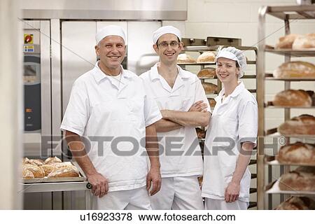 Stock Photo - Chefs smiling together in kitchen. Fotosearch