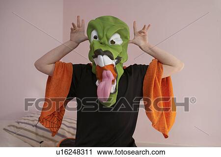 Child grimacing in Halloween costume View Large Photo Image Stock Image - Child grimacing in Halloween costume. Fotosearch