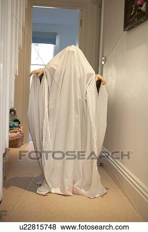 Child wearing ghost Halloween costume View Large Photo Image Stock Photo - Child wearing ghost Halloween costume. Fotosearch