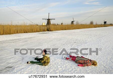 Children in skates laying on ice View Large Photo Image Stock Image - Children in skates laying on ice. Fotosearch