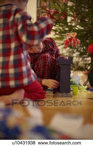 Stock Photo - Children opening Christmas gifts. Fotosearch