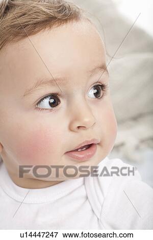 Stock Photo - Close up of babys face. Fotosearch