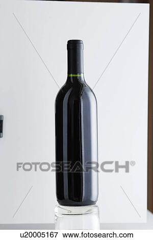 Stock Photo - Close up of bottle of Burgundy wine. Fotosearch