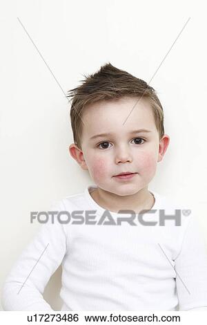 Stock Photograph - Close up of boys smiling face. Fotosearch