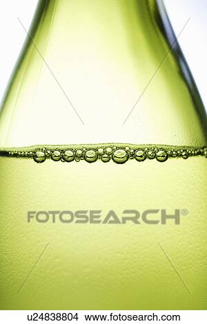 Picture - Close up of bubbles in bottle of wine. Fotosearch