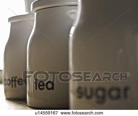 Stock Photo - Close up of coffee, tea and sugar jars. Fotosearch