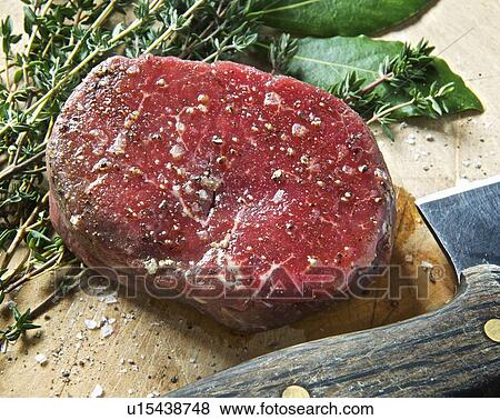 Close up of fillet steak on wooden board View Large Photo Image Stock Photo - Close up of fillet steak on wooden board. Fotosearch