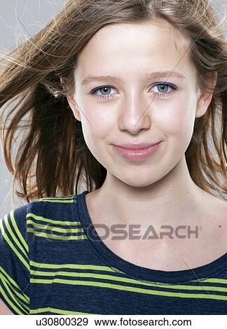 Close up of girls smiling face View Large Photo Image Stock Photo - Close up of girls smiling face. Fotosearch