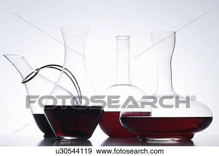 Close up of glass carafes of wine View Large Photo Image Stock Photo - Close up of glass carafes of wine. Fotosearch