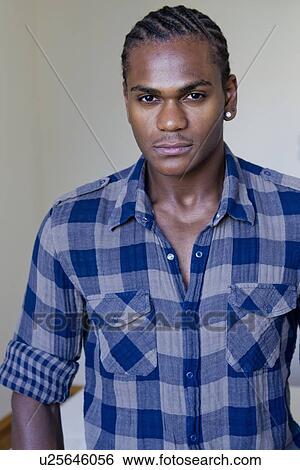 Stock Photograph - Close up of mans serious face. Fotosearch