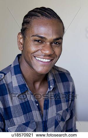 Stock Image - Close up of mans smiling face. Fotosearch