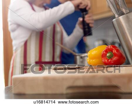 Close up of peppers on cutting board View Large Photo Image Picture - Close up of peppers on cutting board. Fotosearch
