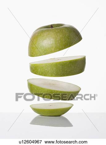 Stock Photo - Close up of slices of apple. Fotosearch