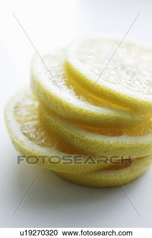 Stock Image - Close up of slices of lemon. Fotosearch