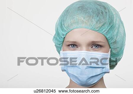 Close up of surgeon wearing facemask View Large Photo Image Stock Photography - Close up of surgeon wearing facemask. Fotosearch
