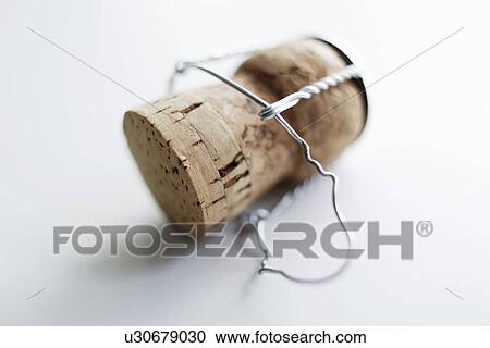 Stock Image - Close up of unscrewed champagne cork. Fotosearch