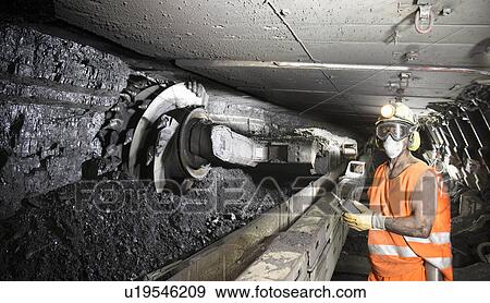 Coal miner working in mine View Large Photo Image Stock Photo - Coal miner working in mine. Fotosearch