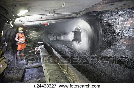 Stock Photo - Coal miner working in mine. Fotosearch