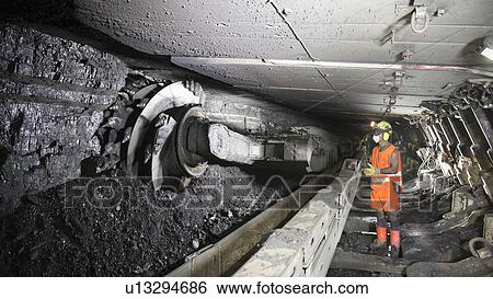 Coal miner working in mine View Large Photo Image Stock Photograph - Coal miner working in mine. Fotosearch