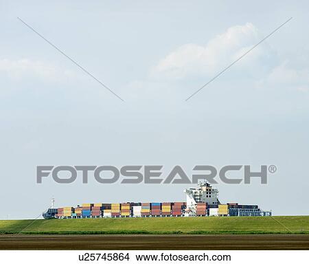 Picture - Containers in shipyard by rural field. Fotosearch