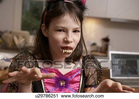 Girl wearing Halloween costume View Large Photo Image Stock Image - Girl wearing Halloween costume. Fotosearch