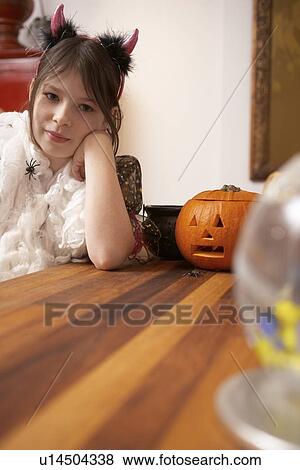 Girl wearing Halloween costume View Large Photo Image Stock Photo - Girl wearing Halloween costume. Fotosearch