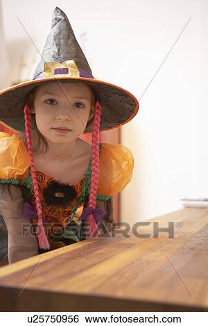 Stock Photograph - Girl wearing Halloween costume. Fotosearch