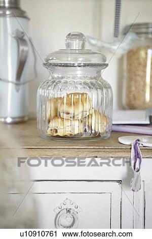 Glass jar of scones on counter View Large Photo Image Stock Image - Glass jar of scones on counter. Fotosearch