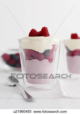 Glasses of berry coconut parfait View Large Photo Image Stock Image - Glasses of berry coconut parfait. Fotosearch