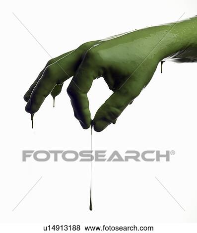 Stock Photo - Green painted hand pinching. Fotosearch