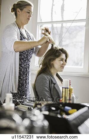 Hair stylist working on client View Large Photo Image Stock Image - Hair stylist working on client. Fotosearch