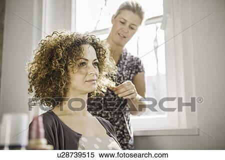 Hair stylist working on client View Large Photo Image Stock Photography - Hair stylist working on client. Fotosearch