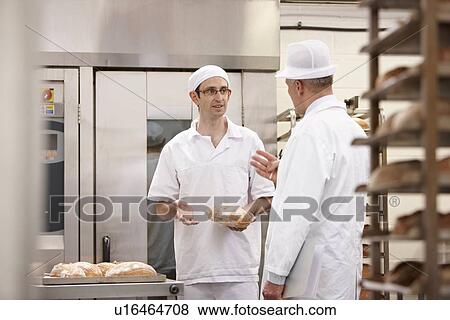 Stock Photo - Health inspector with chef in kitchen. Fotosearch