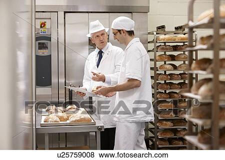 Stock Photo - Health inspector with chef in kitchen. Fotosearch