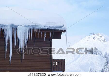 Icicles hanging from cabin in snow View Large Photo Image Stock Image - Icicles hanging from cabin in snow. Fotosearch