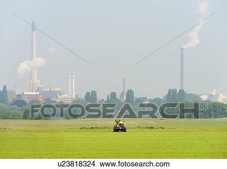 Picture - Industrial buildings by fields. Fotosearch