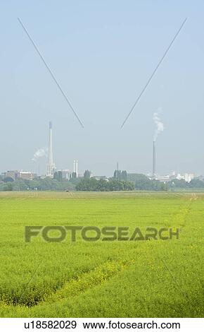 Industrial buildings by fields View Large Photo Image Stock Photo - Industrial buildings by fields. Fotosearch