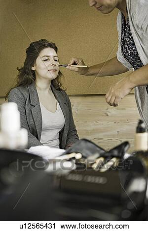 Make up artist working on client View Large Photo Image Stock Image - Make up artist working on client. Fotosearch