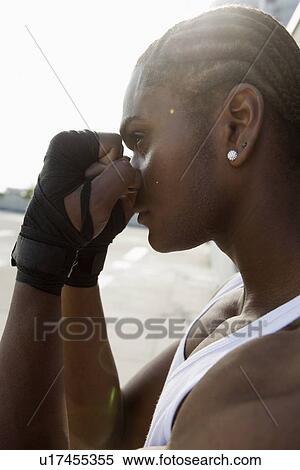 Stock Photography - Man standing with raised fists. Fotosearch