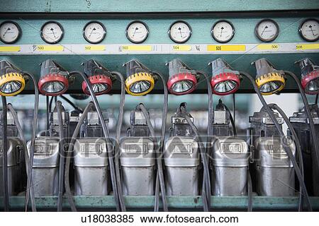 Mining lamps hanging in control room View Large Photo Image Stock Photography - Mining lamps hanging in control room. Fotosearch