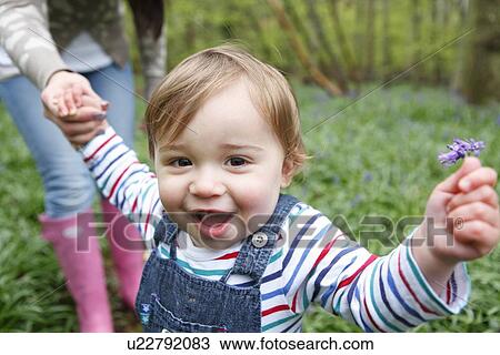 Mother and son playing in forest View Large Photo Image Stock Image - Mother and son playing in forest. Fotosearch